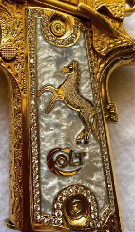 Ornate gold and mother-of-pearl engraving